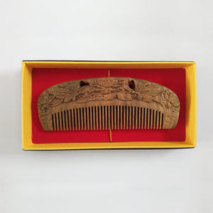 Carved wooden comb